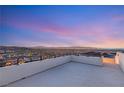 Sweeping panoramic views from the rooftop terrace showcase city lights and distant mountains at 350 Solitude Peak Ln, Henderson, NV 89012