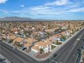 Expansive aerial view of the neighborhood, showcasing the home's location and mountain views in the distance at 3604 N Campbell Rd, Las Vegas, NV 89129