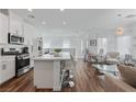 Bright, open kitchen with stainless steel appliances and a large island with bar seating at 3729 Canis Minor Ln # 10206, Henderson, NV 89052