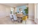 Inviting dining room featuring modern decor and tile flooring at 4439 Bayley Skye Ave # 105, Las Vegas, NV 89141