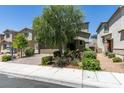 Charming two-story home with a brick-paved driveway, mature landscaping, and an inviting front entrance at 4633 Fragrant St, North Las Vegas, NV 89031