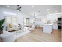 Spacious living room features contemporary design, light-colored walls, and luxury seating area at 502 Edgefield Ridge Pl, Henderson, NV 89012