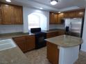 Spacious kitchen with granite countertops, stainless appliances, and a large island at 6604 Octave Ave, Las Vegas, NV 89139