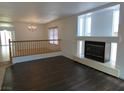 Cozy living room with fireplace and abundant natural light for a welcoming atmosphere at 6604 Octave Ave, Las Vegas, NV 89139