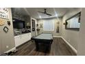 Spacious game room features a pool table, ceiling fan, and modern finishes at 716 Cadence View Way, Henderson, NV 89011