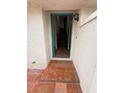 The entryway of the house has tile flooring that leads to a wooden staircase at 7969 Cina Ave, Las Vegas, NV 89147