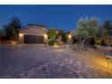 Beautiful home exterior features a paved brick driveway leading to a spacious two-car garage at 8 Laricola Ct, Henderson, NV 89011