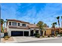 Charming two-story home with a three car garage and landscaped front yard at 8713 Castle Ridge Ave, Las Vegas, NV 89129