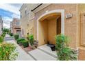 Inviting front entrance featuring a covered porch and landscaped surroundings at 1056 at 9303 Gilcrease Ave # 1056, Las Vegas, NV 89149
