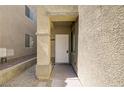 Close up of the home's front door and entryway with stone walkway at 9452 Plover Falls Ave, Las Vegas, NV 89149