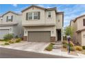 Attractive home featuring a two-car garage and easy-care desert landscaping for a welcoming curb appeal at 10836 Montana Blanca Ave, Las Vegas, NV 89166