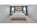 Serene main bedroom with neutral tones, large windows, and stylish decor at 10836 Montana Blanca Ave, Las Vegas, NV 89166