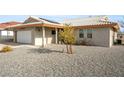 Exterior elevation showcasing gravel landscaping and roof at 1261 S Comstock St, Pahrump, NV 89048