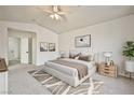 Serene main bedroom with plush carpeting, a neutral color scheme, and ample natural light for relaxation at 1604 Tamborine Ct, Las Vegas, NV 89128