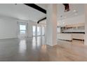 Modern living room with polished concrete floors and an open floor plan to the kitchen at 200 Hoover Ave # 1905, Las Vegas, NV 89101