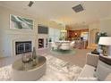 Open-concept living area flows into a well-equipped kitchen with a fireplace and eating area at 21 Via Visione # 206, Henderson, NV 89011