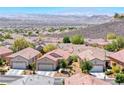 Scenic aerial view of a well-maintained community with mountain views at 2501 Celestial Light Dr, Henderson, NV 89044
