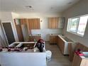 Kitchen in progress with wood cabinets and hardware being installed at 2561 Red Rock Dr, Pahrump, NV 89048