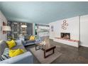 Open living room with slate floors and fireplace at 3212 Silver Saddle St, Las Vegas, NV 89169