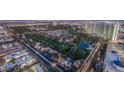 Expansive aerial view of a neighborhood featuring lush greenery, a golf course, and charming homes at 322 Karen Ave # 3801, Las Vegas, NV 89109