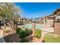 Community pool surrounded by lush landscaping, perfect for relaxation and recreation at 4083 Nook Way # D, Las Vegas, NV 89103