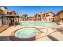 Inviting community pool and spa area for residents to enjoy, with ample seating at 4083 Nook Way # D, Las Vegas, NV 89103