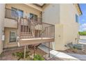 A low rise complex with a walkway, stairs and landscaping at the side of the home at 4800 Grey Wolf Ln # 202, Las Vegas, NV 89149