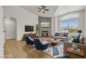 Staged living room boasts fireplace, modern furnishings, and a view of the outdoors at 4800 Grey Wolf Ln # 202, Las Vegas, NV 89149