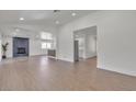 Bright open-concept living room featuring a modern fireplace and stylish flooring at 5079 Reno Ct, Las Vegas, NV 89119