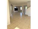 Spacious living room with tile flooring, bright windows, and modern design at 6024 Ripple Cloud Ct, North Las Vegas, NV 89031