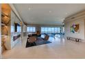 Open-concept living area with floor-to-ceiling windows provides abundant natural light and panoramic views at 677 Overlook Rim Dr, Henderson, NV 89012