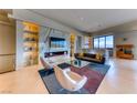 Stylish living room features a sleek fireplace, modern furnishings, and bright, open space at 677 Overlook Rim Dr, Henderson, NV 89012