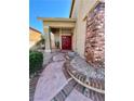 Inviting front entrance featuring a red double door and decorative brick accents at 8397 San Ramon Dr, Las Vegas, NV 89147