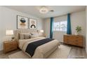 Well-lit bedroom with coordinated furnishings, modern decor, and natural light from the window at 875 Rhinegold Way, Las Vegas, NV 89110