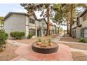 View of well maintained townhomes and landscape, showcasing a bright neighborhood at 875 Rhinegold Way, Las Vegas, NV 89110