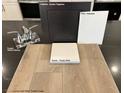 Interior finishes showcase wood-look flooring, granite, paint, cabinet, and faucet samples at 9243 Charmillin Ct, Las Vegas, NV 89148