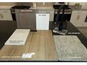 Kitchen featuring sleek matte black faucet, white quartz, and wood flooring at 9249 Charmillin Ct, Las Vegas, NV 89148