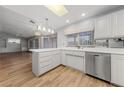 Bright kitchen featuring an island counter, sink with modern fixtures, and stainless steel appliances at 9917 Arbuckle Dr, Las Vegas, NV 89134