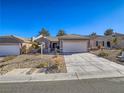 Charming single-story home with a well-maintained landscaped front yard and two car garage at 1510 Fieldbrook St, Henderson, NV 89052