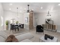 Dining room area with modern lighting, stone pillar, and contemporary furnishings at 1816 Mazzanti Way, Henderson, NV 89014