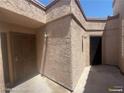 A charming private front porch area with lighting offers a cozy entrance to the home at 1850 Camino Verde Ln, Las Vegas, NV 89119
