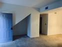 The open-concept living room welcomes you with fresh paint and new carpet at 2121 Hussium Hills St # 107, Las Vegas, NV 89108