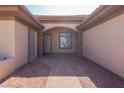 An arched entrance showing a walkway to a front door in a single-story home at 271 E Shelbourne Ave, Las Vegas, NV 89123