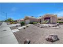 Charming single-story home with desert landscaping, concrete steps, and a two-car garage at 2805 Hanging Rock Dr, Las Vegas, NV 89134