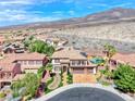 High-angle view of the property, showcasing the pool, desert landscaping, and the surrounding neighborhood at 2820 Sisteron Ct, Henderson, NV 89044