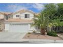Charming two-story home with a two-car garage, tile roof and desert landscaping at 3750 Morning Canyon St, Las Vegas, NV 89147