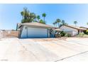 Charming single-story home featuring a two-car garage, desert landscaping, and a welcoming front entrance at 4381 Toledo Ave, Las Vegas, NV 89121