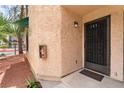 Attractive condo entrance with a decorative security door and a convenient fire extinguisher box at 440 Elm Dr # 103, Las Vegas, NV 89169