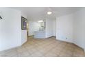 Open floor plan showcasing the living room with tile flooring that flows seamlessly into the kitchen area at 440 Elm Dr # 103, Las Vegas, NV 89169