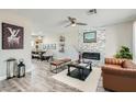 Open living area with an electric fireplace, modern decor, and dining area view at 445 Concord Way, Henderson, NV 89015